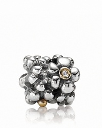 A cluster of sterling silver daisies with 14K gold and diamond centers. Charm by PANDORA. A cluster of sterling silver daisies with 14K gold and diamond centers. Charm by PANDORA.