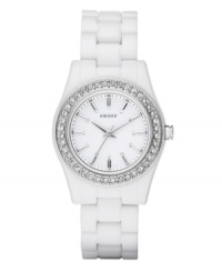 DKNY proves that white is anything but plain on this glittering watch. White plastic bracelet and round case. Stainless steel bezel embellished with crystal accents. White dial features silver tone stick indices, crystal accents at markers, minute track, three hands and logo. Quartz movement. Water resistant to 50 meters. Two-year limited warranty. DKNY proves that white is anything but plain on this glittering watch. White plastic bracelet and round case. Stainless steel bezel embellished with crystal accents. White dial features silver tone stick indices, crystal accents at markers, minute track, three hands and logo. Quartz movement. Water resistant to 50 meters. Two-year limited warranty.