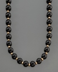A dramatic and striking necklace featuring onyx beads (8 mm) separated by polished 14k gold beads. Length measures 30 inches. A dramatic and striking necklace featuring onyx beads (8 mm) separated by polished 14k gold beads. Length measures 30 inches.
