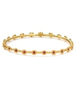 Embrace the season's eclectic approach to accessorizing with this hammered gold-plated bangle from Melinda Maria. Designed to add a touch of luxe to every look this piece is adorned with striking crystal stations.