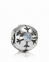 A delicately etched snowflake with a sparkling aqua zirconia center adorns this sterling silver charm by PANDORA. A delicately etched snowflake with a sparkling aqua zirconia center adorns this sterling silver charm by PANDORA.