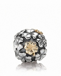 This PANDORA charm is lucky find -- a sterling silver field of clovers with four-leaf varieties in 14K gold. This PANDORA charm is lucky find -- a sterling silver field of clovers with four-leaf varieties in 14K gold.