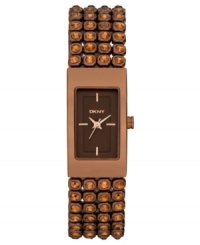 Rows of elegant shine adorn this ladylike watch from DKNY. Rows of elegant shine adorn this ladylike watch from DKNY.