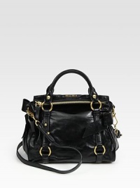 Shiny vitello calfskin in a top-handle silhouette with bow detail at the sidesDouble top handles, 4½ dropDetachable shoulder strap, 20 dropTop zip closureMetal letter logo detailProtective metal feetOne inside open pocketCotton/satin lining10W X 7H X 4DMade in Italy Shiny vitello calfskin in a top-handle silhouette with bow detail at the sidesDouble top handles, 4½ dropDetachable shoulder strap, 20 dropTop zip closureMetal letter logo detailProtective metal feetOne inside open pocketCotton/satin lining10W X 7H X 4DMade in Italy