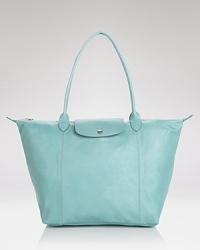 This season, Longchamp gives it's signature Le Pliage bag a luxe update. Now in super-soft leather, it's a rich take on the practical style you need (and love.) This season, Longchamp gives it's signature Le Pliage bag a luxe update. Now in super-soft leather, it's a rich take on the practical style you need (and love.)